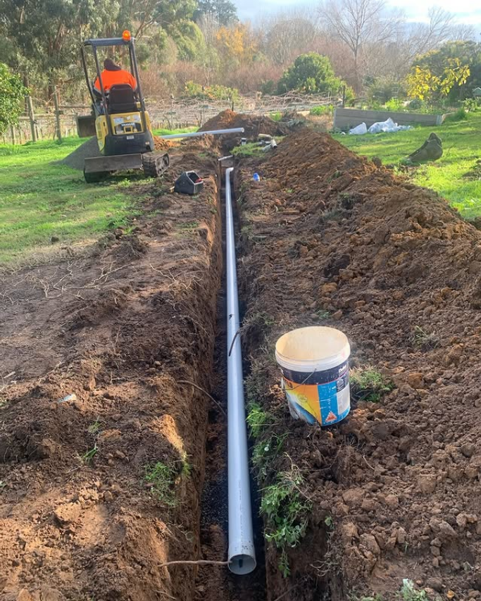 Plumber Geelong clearing a blocked drain with professional equipment